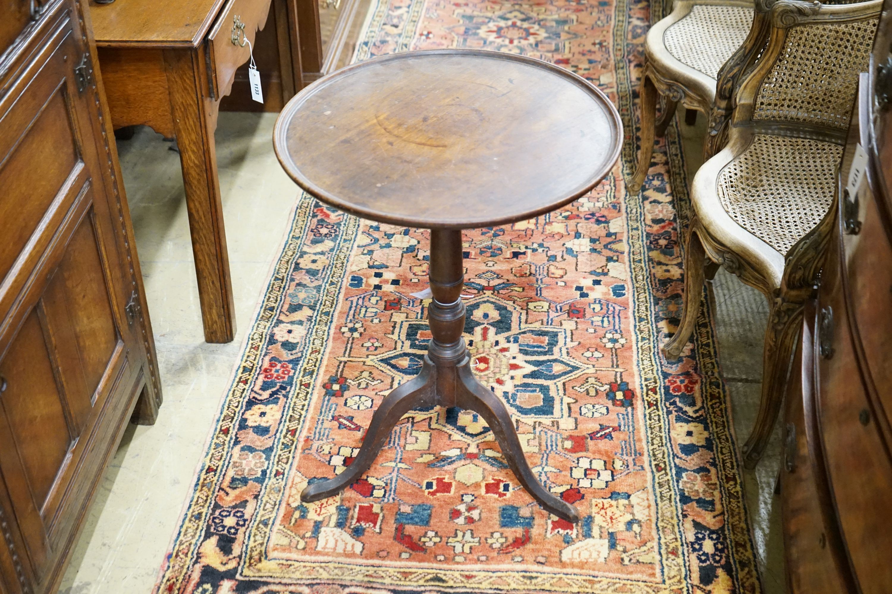 A George III mahogany tilt top tripod table, diameter 53cm, height 71cm